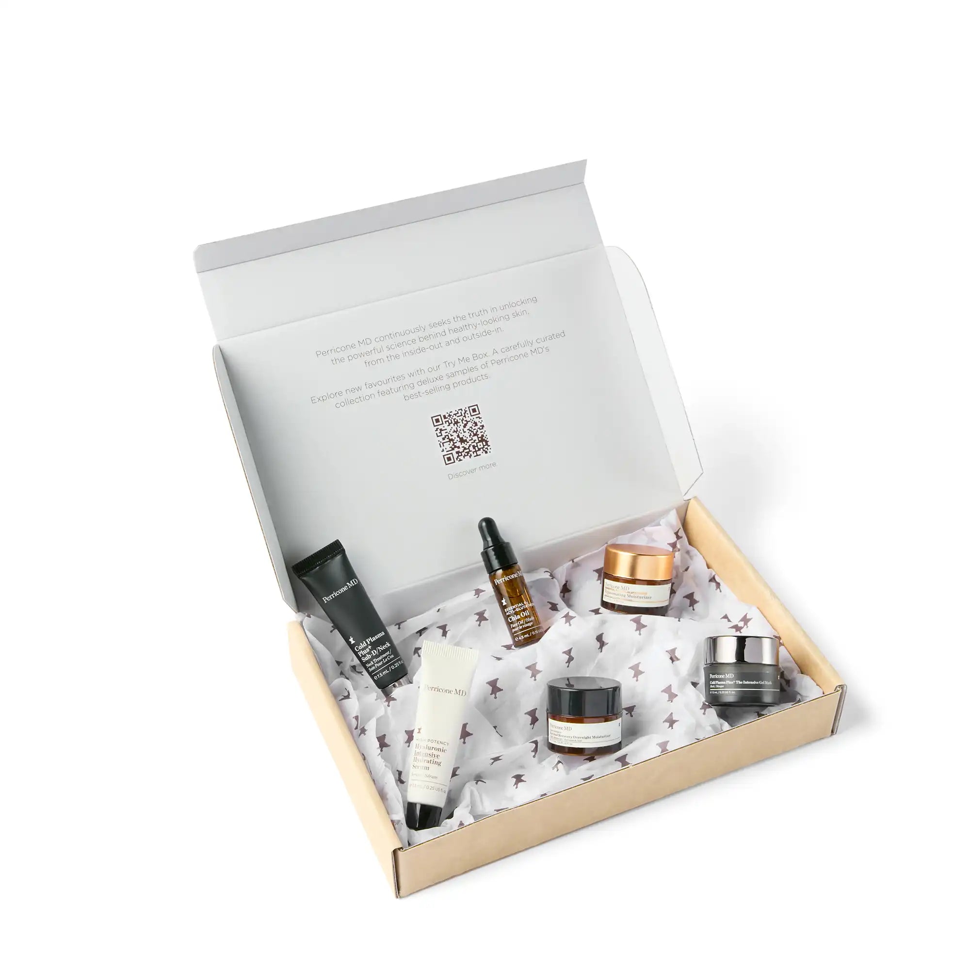 Caja de cartón abierta y dentro se ven los 6 envases de los cosméticos que componen el kit Try Me Box